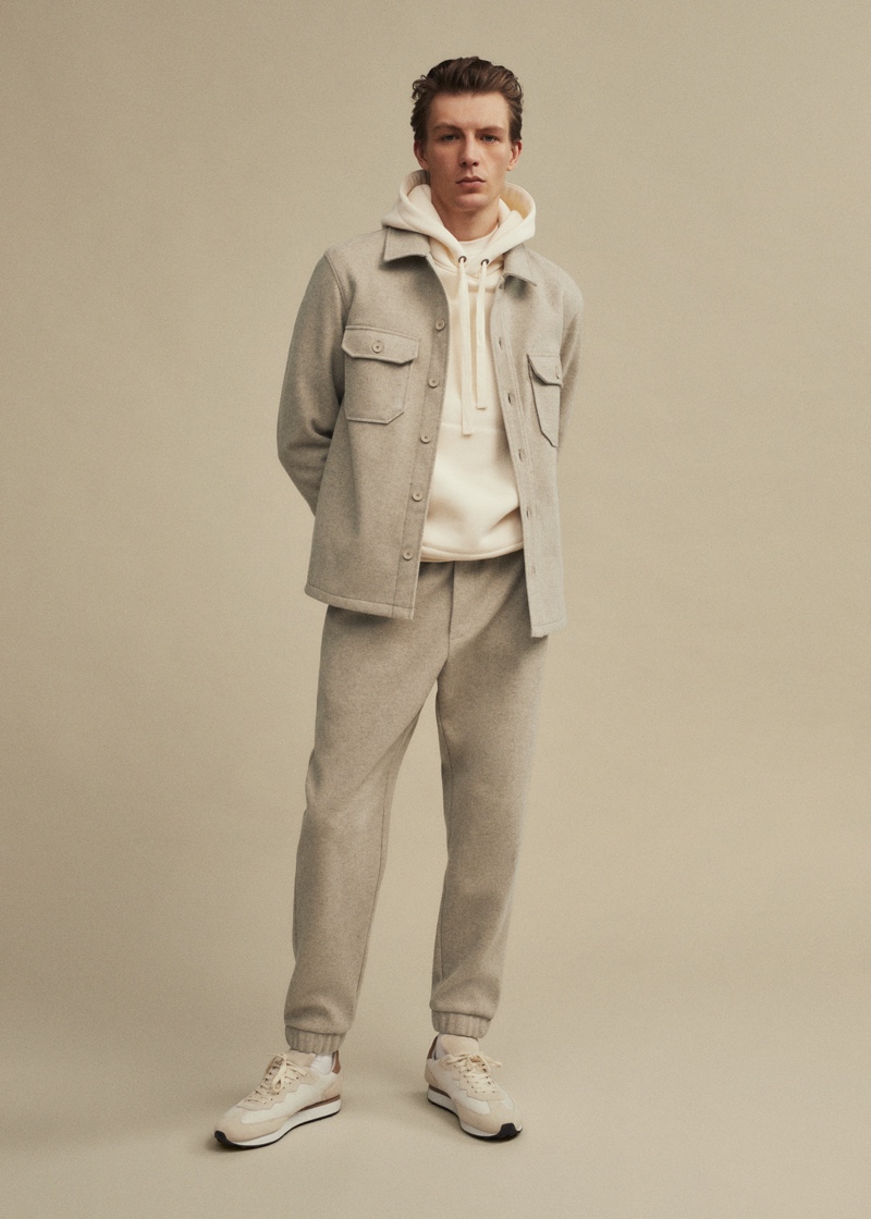 Embracing leisure and style, Finnlay Davis wears a pocket textured jacket and jogger pants from Mango.