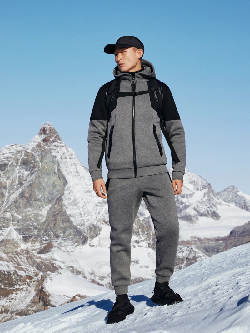 Sang Woo Kim sports a gray and black matching set from Mango Man's Improved collection.