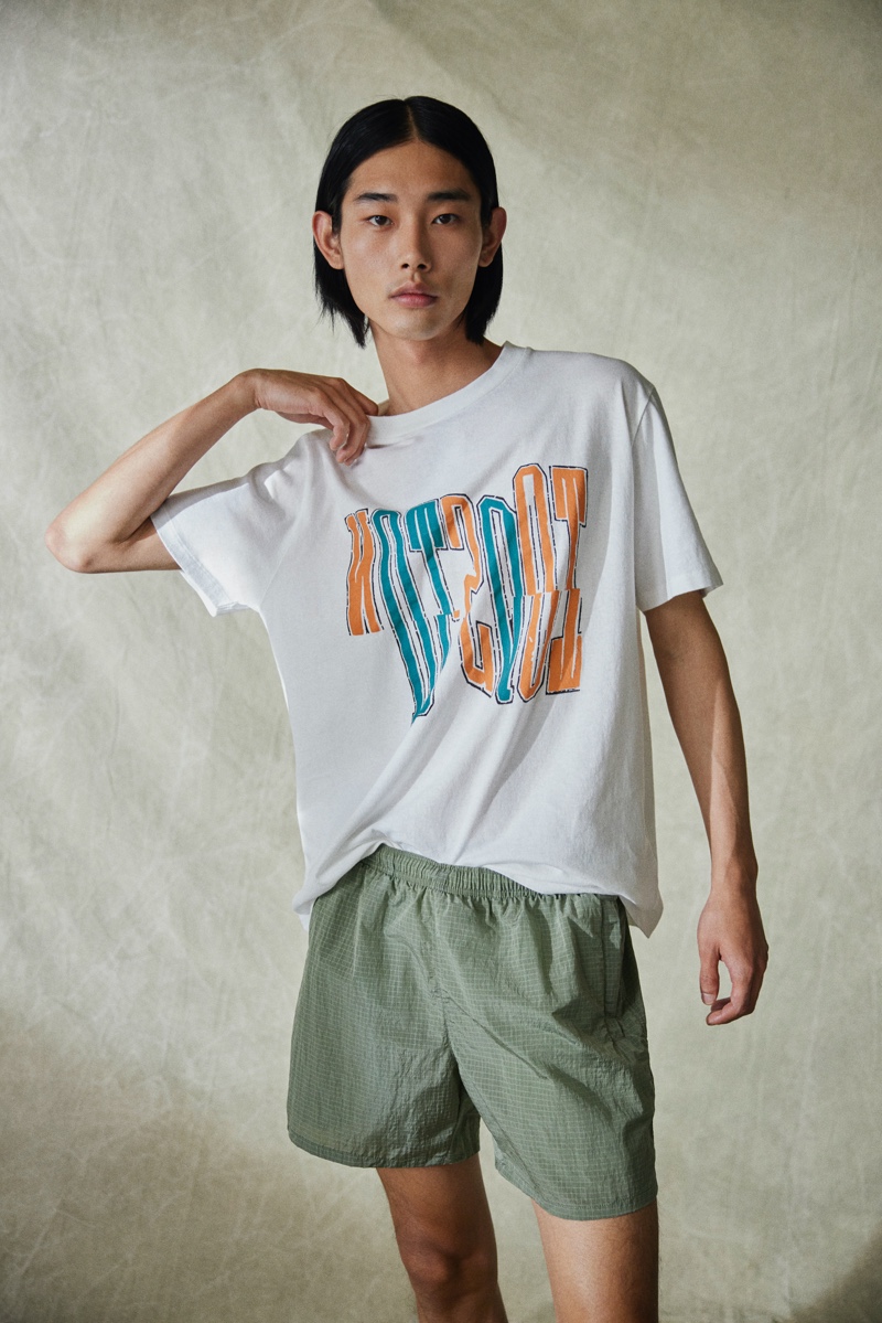 Taemin Park sports a graphic t-shirt with shorts from the Our Legacy x Mytheresa capsule collection.