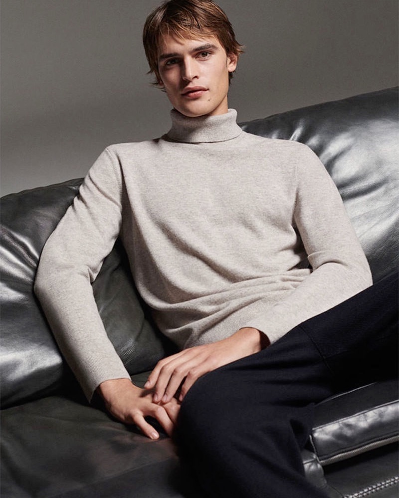 In front and center, Parker van Noord sports a turtleneck from COS.
