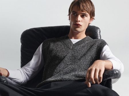 Embracing smart style, Parker van Noord wears a ribbed sweater vest from COS.