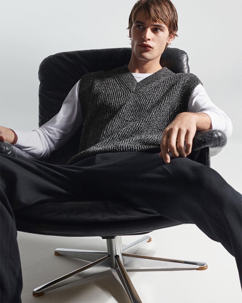 Embracing smart style, Parker van Noord wears a ribbed sweater vest from COS.