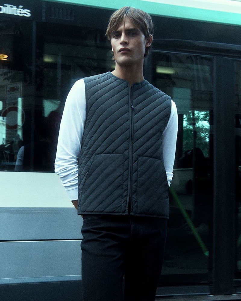 Stepping outdoors, Parker van Noord rocks a padded vest from COS.