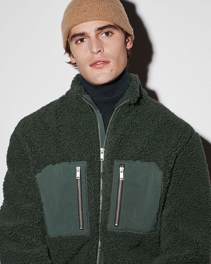 Dressed for winter, Parker van Noord wears a full-zip fleece jacket from COS.