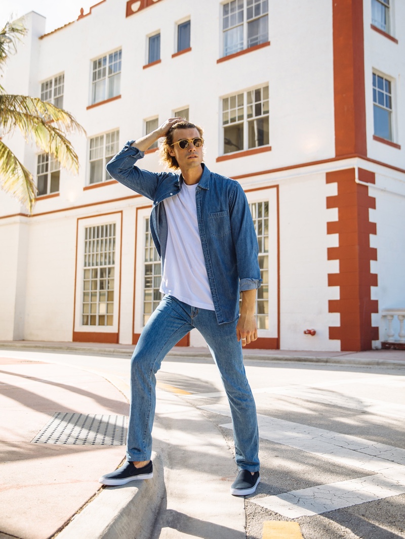 Doubling down on denim, Alexander Command sports Peluro's medium wash denim jeans.