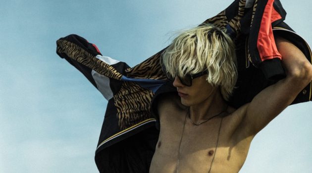 Saint Laurent Revs Up with New Rive Droite Collaborations Heading to the beach, Rocco Segers wears a K-Way bomber with a tiger print from Saint Laurent's Rive Droite line.