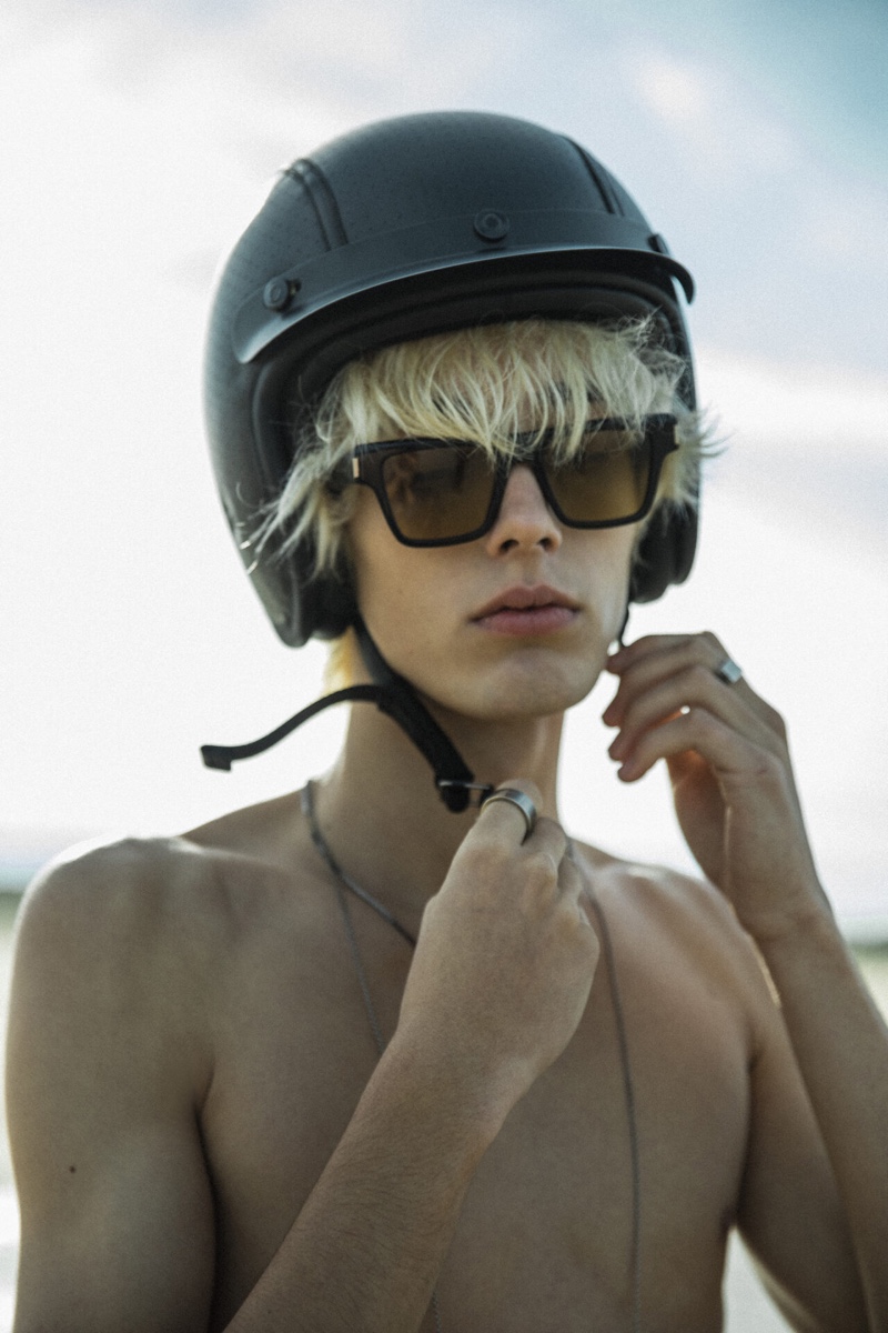 Rocco Segers wears Saint Laurent sunglasses with a Hedon helmet redesigned for the brand's Rive Droite line.