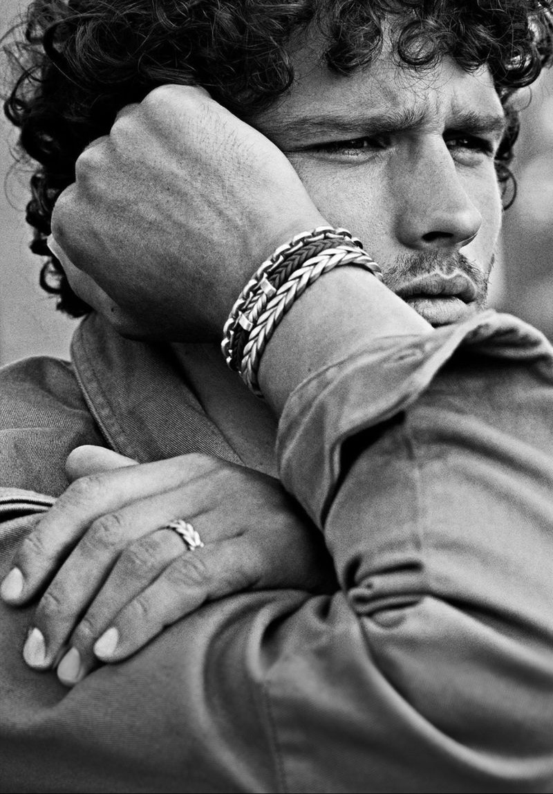 Simon Nessman dons David Yurman Chevron bracelets and a matching sterling silver Chevron ring for the brand's fall-winter 2021 campaign.