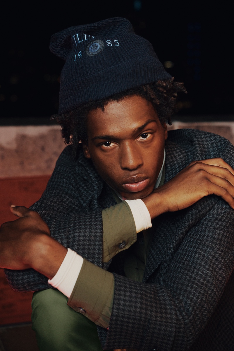Tamel Lee dons a herringbone jacket for Tommy Hilfiger's holiday 2021 campaign.