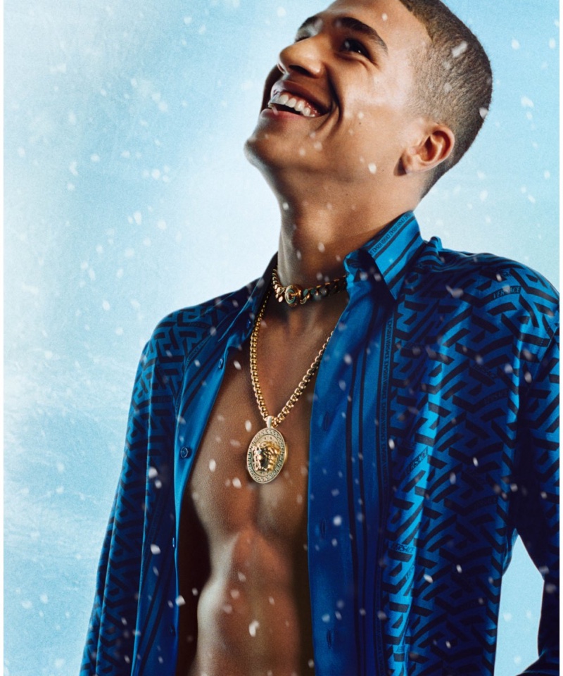 All smiles, Nando Maxwell fronts Versace's holiday 2021 campaign.