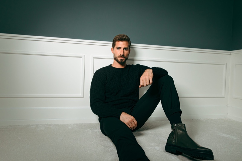 Embracing monochrome style, Kevin Trapp wears a black ensemble from his ABOUT YOU capsule collection.