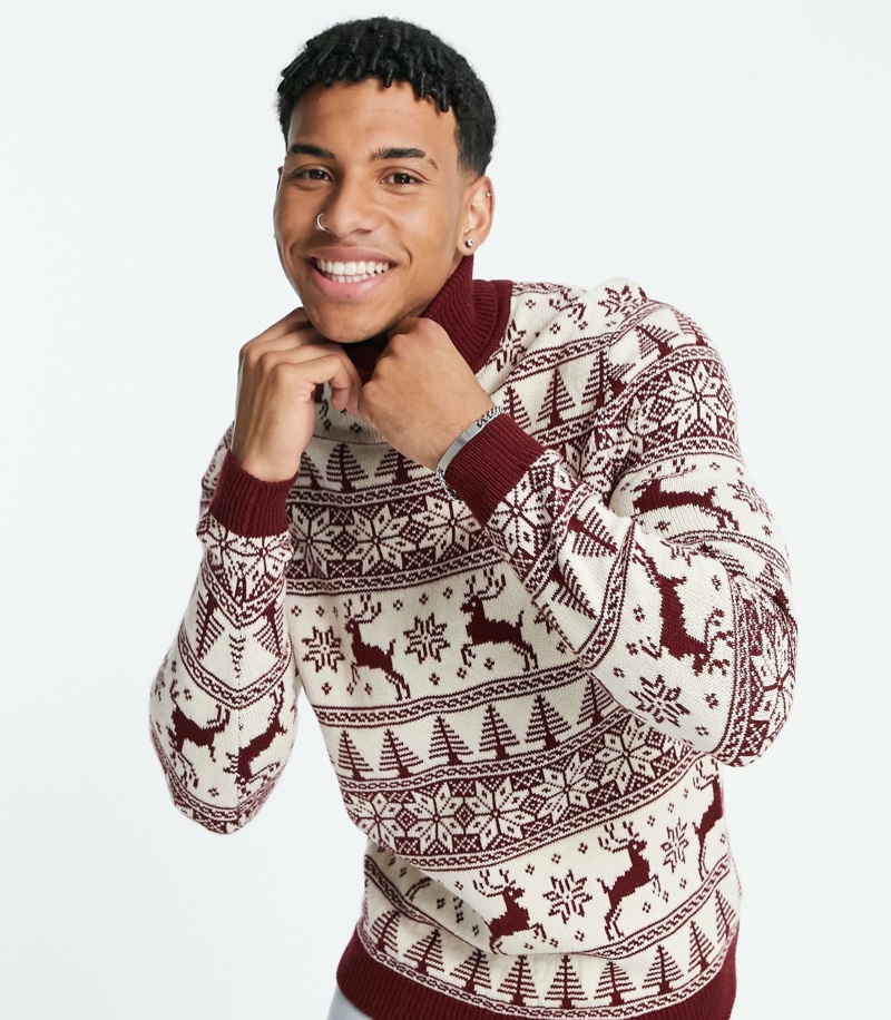 Louis Russell is all smiles in ASOS's knitted Christmas sweater with fairisle stag in red.