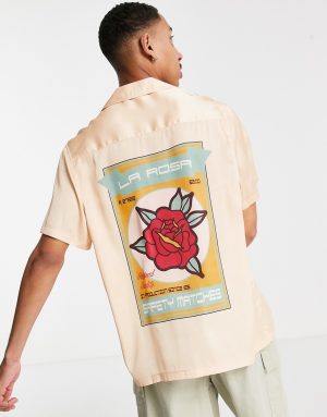 ASOS DESIGN relaxed deep revere satin shirt with rose placement print in pink ASOS DESIGN relaxed deep revere satin shirt with rose placement print in pink