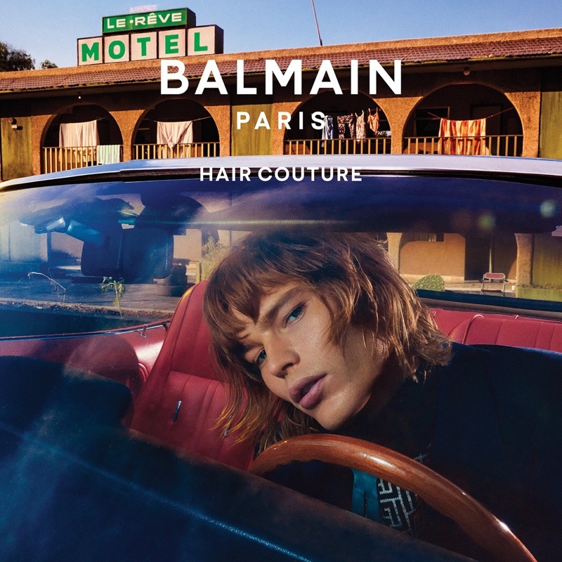 An Le photographs Jordan Barrett on the set of "Fracture" in front of the Le Rêve hotel for the Balmain Paris Hair Couture fall-winter 2021 campaign.