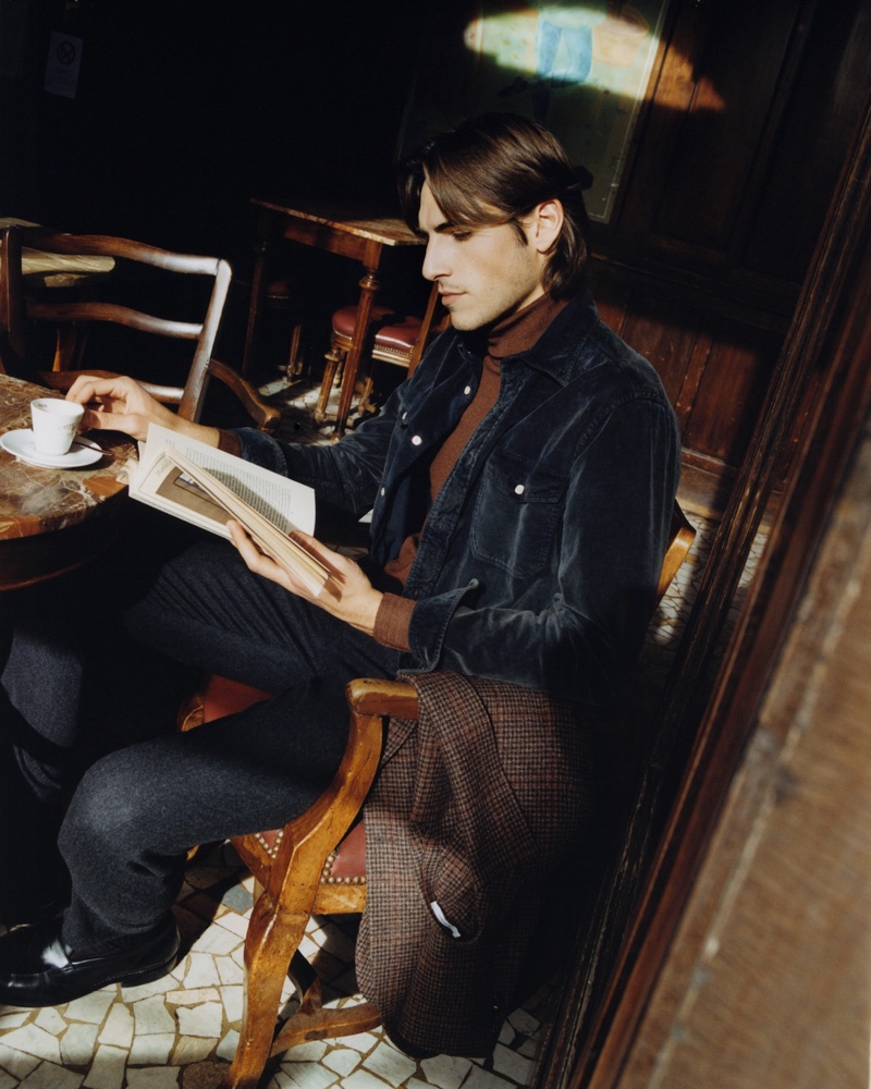 Enjoying a good book at a cafe, Enrico Maria Valenti makes an appearance in Boglioli's fall-winter 2021 campaign.