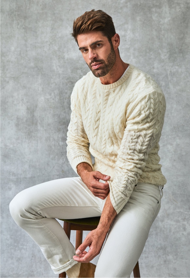A smart vision in light colors, Chad White models a Todd Snyder lambswool cable-knit crew sweater with slim-fit 5-pocket Italian corduroy pants.