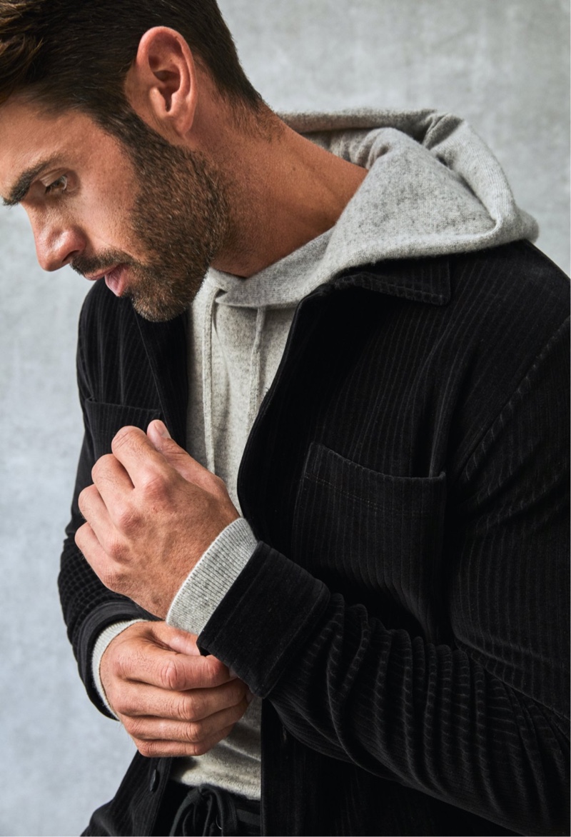 Showcasing a little texture, Chad White wears a ribbed velour button-down and pants with an Italian luxe heather grey cashmere full-zip hoodie by Todd Snyder.