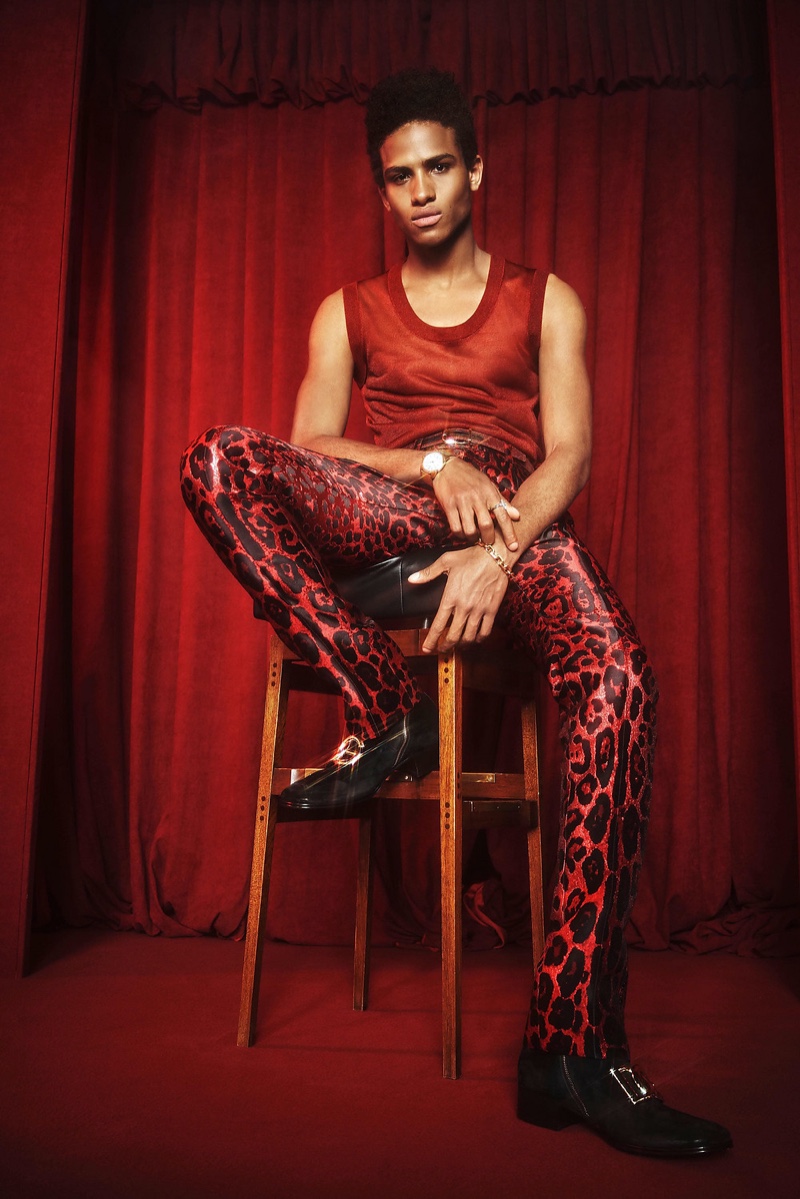 In front and center, model Maal Aziz makes a red statement in a tank and leopard print trousers from Dolce & Gabbana's spring-summer 2022 Hot Animalier collection.