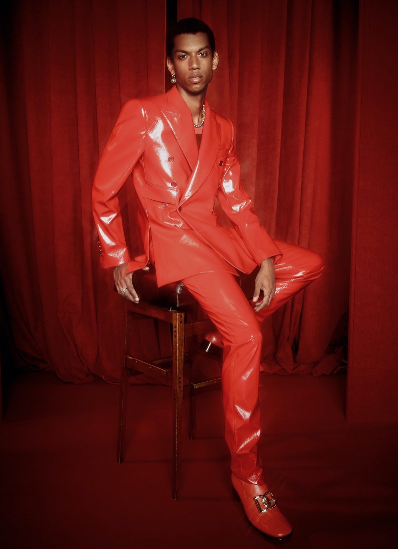 Giulio stands out in a fiery red leather suit from Dolce & Gabbana's spring-summer 2022 Hot Animalier collection.