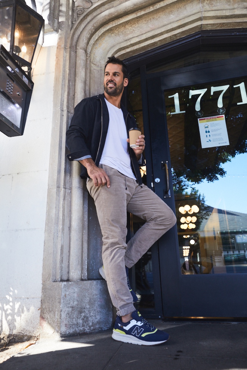 All smiles, Eric Decker wears New Balance 997H sneakers for DSW.