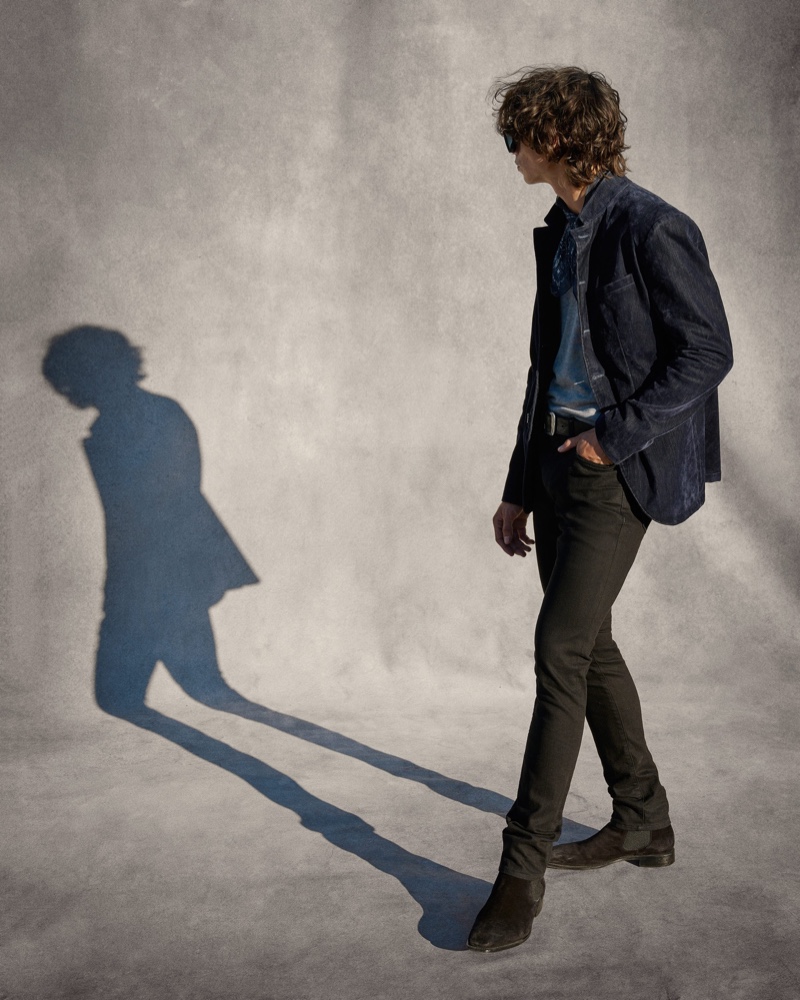 Embracing a slim silhouette, Griffin Reed dons a look from John Varvatos' resort 2022 collection.
