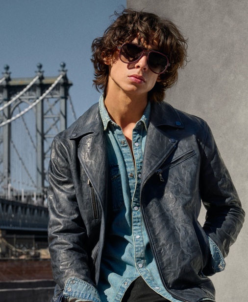 In front and center, Griffin Reed rocks a John Varvatos Marshall denim shirt with a biker jacket.