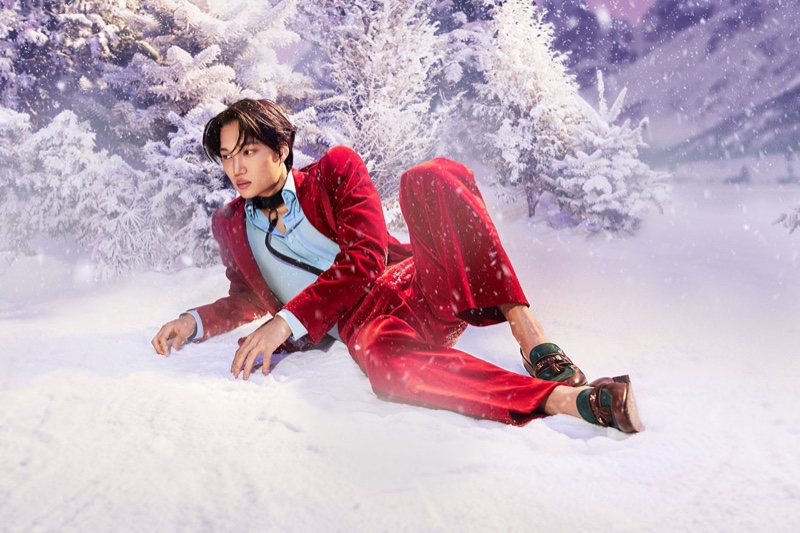 Kai dons a festive red suit for the Gucci Aria holiday 2021 campaign.
