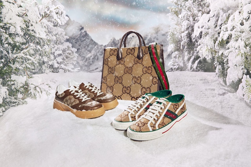 Stylish GG logo sneakers and a bag are front and center for the Gucci Aria holiday 2021 campaign.