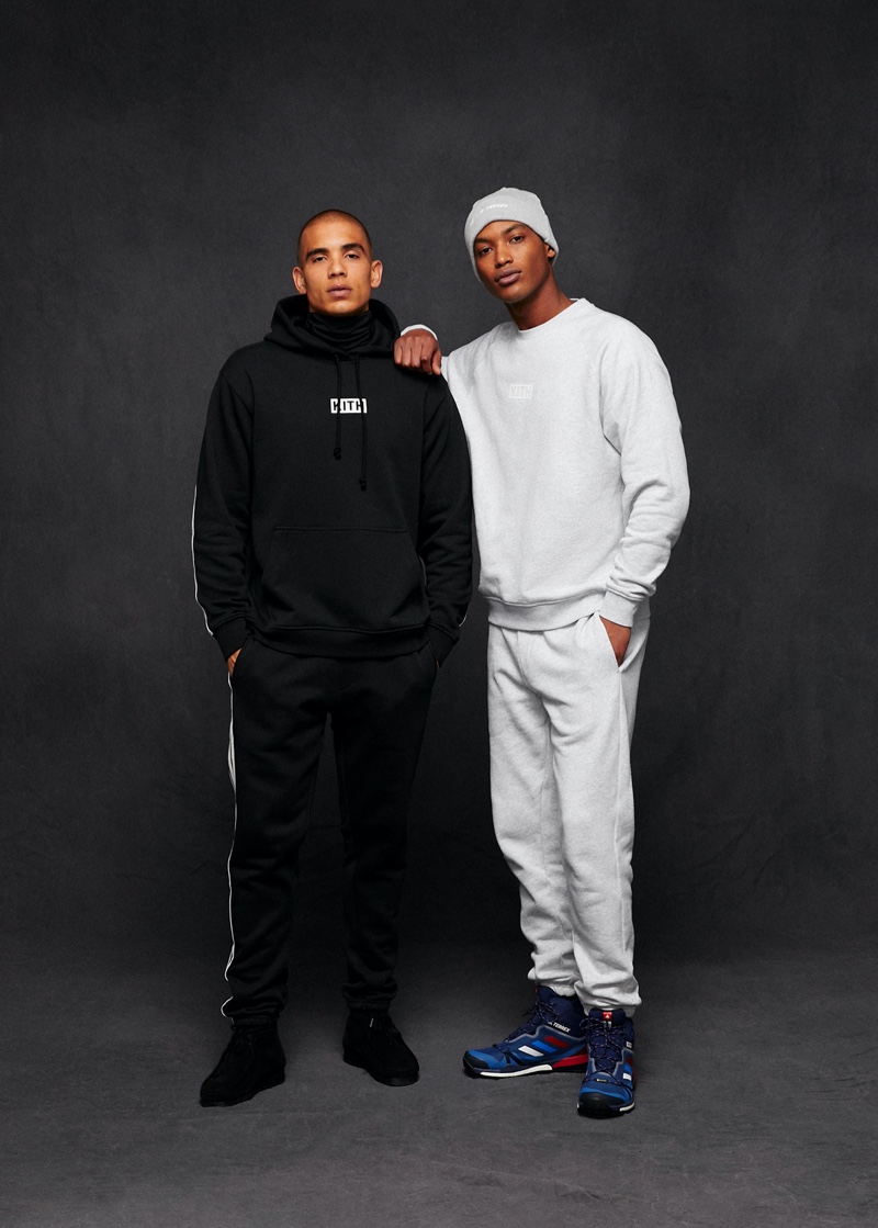Wearing sweatshirts, joggers, and sneakers, Colin Alexander and Timothy Lewis wear Kith x adidas Terrex.
