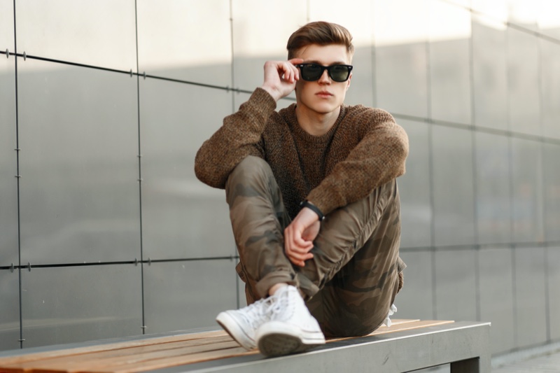 Male Model Neutral Sweater Camo Pants Sitting