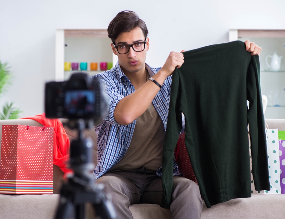 Man Filming Video Clothes Shopping Bags