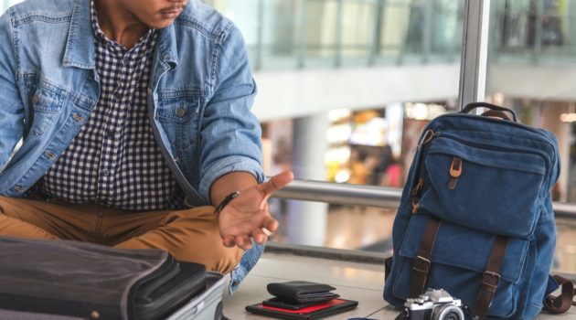 Gambling Abroad: What to Know? Man Luggage Trip Open