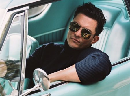 Getting behind the wheels of a vintage car, Orlando Bloom poses for the pages of Esquire magazine.