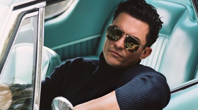 Getting behind the wheels of a vintage car, Orlando Bloom poses for the pages of Esquire magazine.