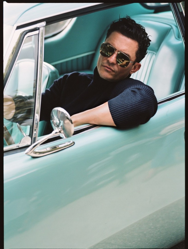 Getting behind the wheels of a vintage car, Orlando Bloom poses for the pages of Esquire magazine.