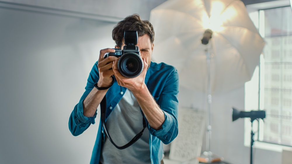 Photographer Shooting Camera Lens