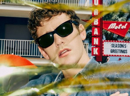 Tom Webb rocks sunglasses for Ray-Ban's holiday 2021 campaign.