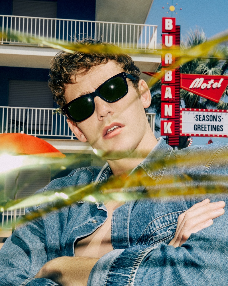 Tom Webb rocks sunglasses for Ray-Ban's holiday 2021 campaign.