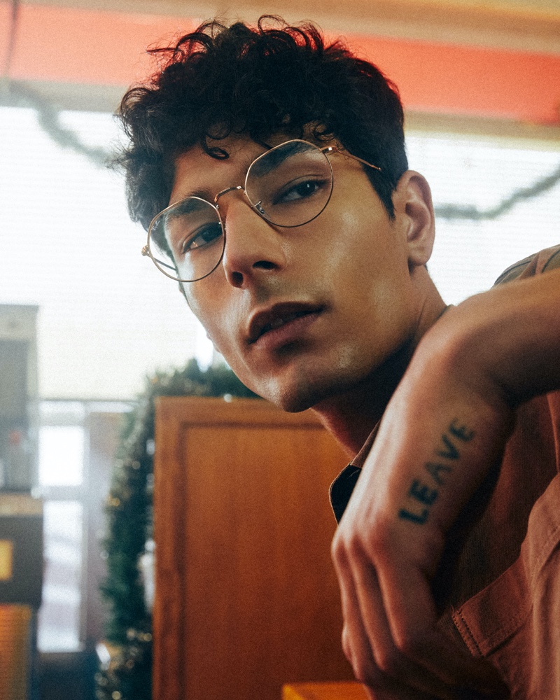 Noah (Fifth Models) wears RX6465 Jack Opticals glasses for Ray-Ban's holiday 2021 campaign.