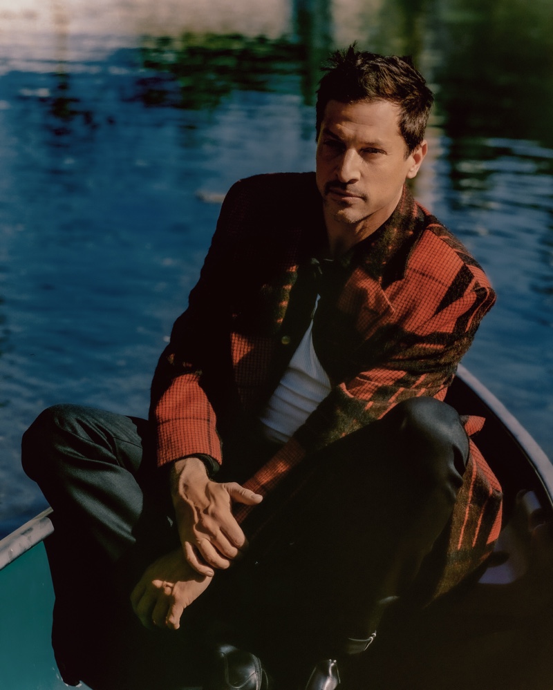 Donning a Louis Vuitton coat, Simon Rex poses for the pages of WSJ. magazine.