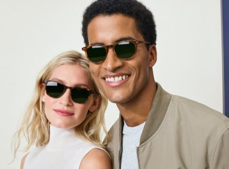 Pictured right, Adom wears Warby Parker's Malik glasses in Maple Tortoise, opposite the brand's Dawson eyewear in Oak Barrel.