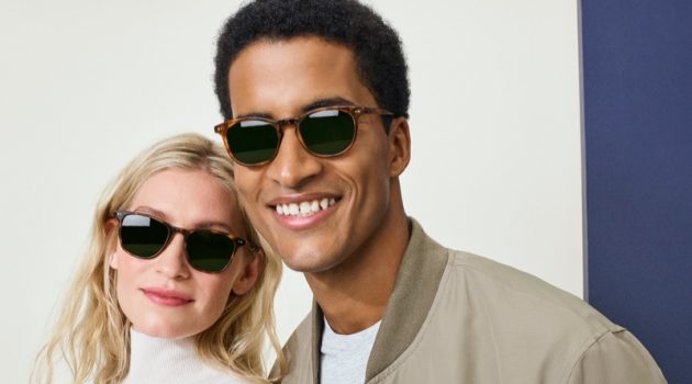 Pictured right, Adom wears Warby Parker's Malik glasses in Maple Tortoise, opposite the brand's Dawson eyewear in Oak Barrel.