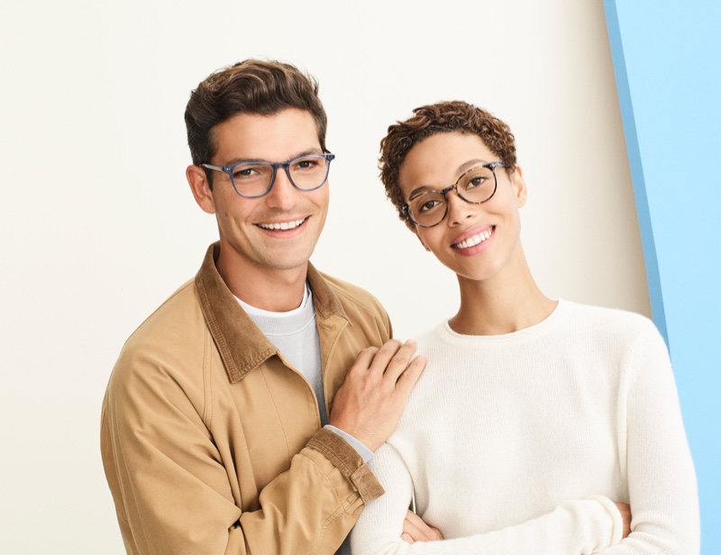 Smiling ear to ear, Benj Lee models Warby Parker's Dawson glasses. The brand's Blakeley tortoiseshell glasses are pictured right.