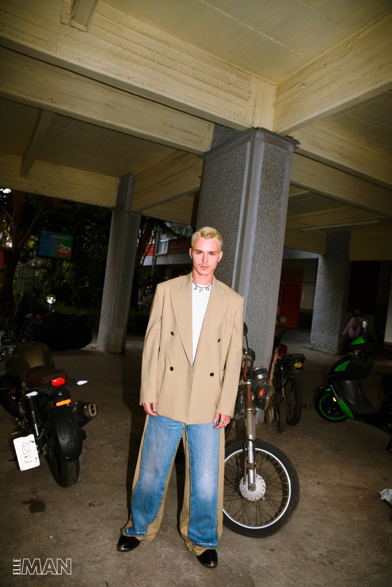 Cleaning up in a fashion-forward look, Arón Piper wears a Jean Paul Gaultier look with Louis Vuitton boots and Tiffany & Co. jewelry for Elle Man México.