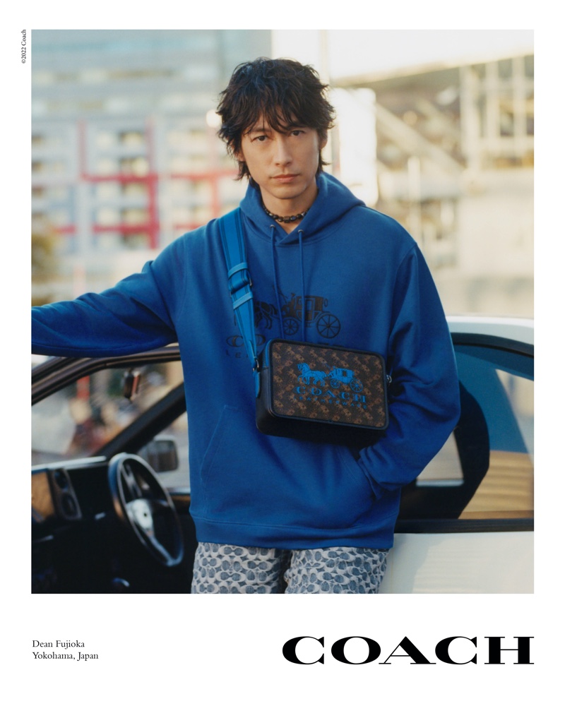 Going casual in Coach, Dean Fujioka fronts the brand's spring-summer 2022 campaign.