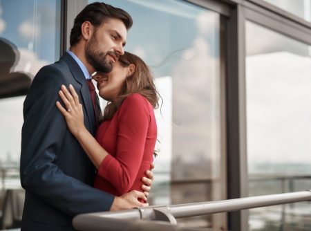 Engaged Couple Embracing Man Suit