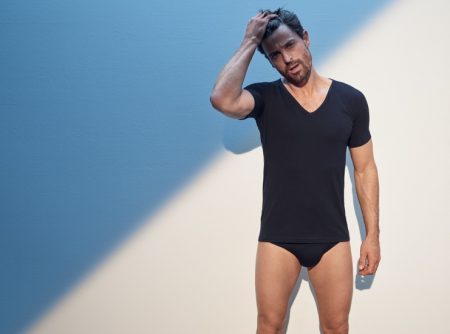 Dressed in black, Niko Ohlsson sports a FALKE Daily Climate V-neck shirt and underwear briefs.