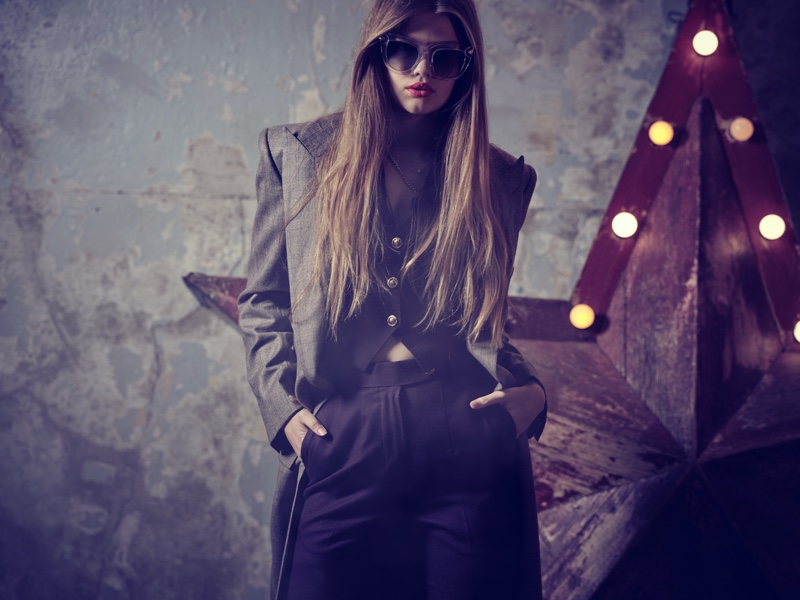 Astral Appleby wears a tailored number by Helen Anthony with Anna-Karin Karlsson sunglasses.