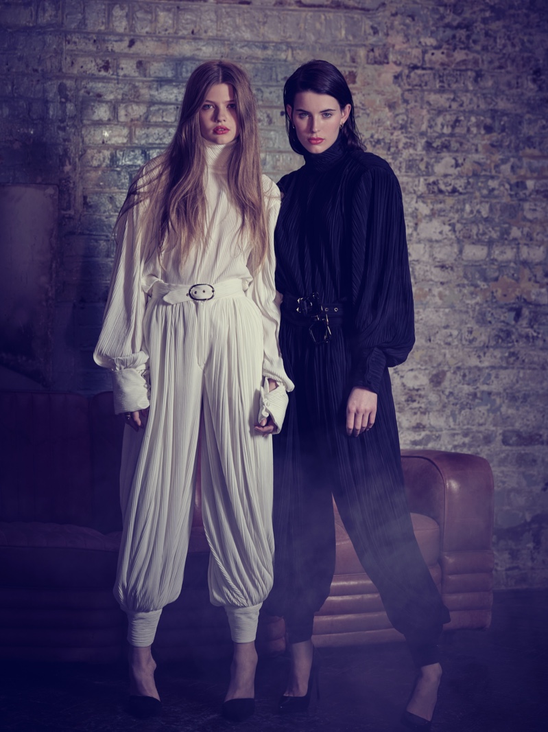 Astral Appleby and Claudia Lavender wear belted jumpsuits by Helen Anthony.