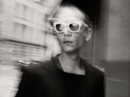 Model Yuri Pleskun rocks white-framed sunglasses for Jacques Marie Mage's spring-summer 2022 campaign.